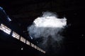 smoke bomb cloud in deserted empty hangar