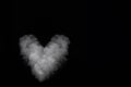 White smoke heart shape isolated on black background. Curly smoke for Valentine's Day Royalty Free Stock Photo