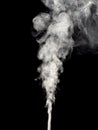 White smoke isolated on a black, swirls and rises upwards as an abstract effect Royalty Free Stock Photo