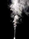 White smoke jet isolated on a black, rising tubers upwards as an abstract effect Royalty Free Stock Photo
