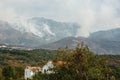 White smoke in the mountains of Montenegro. Large source of fire ignition in smoke.