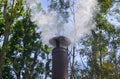 White smoke from the pipe stoves