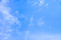 blurred white smoke plane on clouds background, soft focus blue sky background