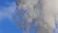 White smoke rises from the pipes of an industrial plant. Pollutant Emissions from factories. Smoke from a factory large