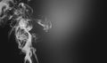 White smoke swirls over black background. stop addiction, healthcare concept