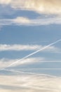 The white smoke trail from the rocket launch goes into the sky behind the clouds, gas jets from the jet engine.Concept: missile at Royalty Free Stock Photo