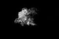 White smoke vapor in the form of a flying cloud is isolated on a black background. Smoky background. Royalty Free Stock Photo