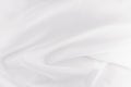 White smooth luxury silk or satin texture with liquid waves for wedding background.