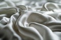 White smooth satin or silk texture background. White fabric abstract texture. Luxury satin cloth. Silky and wavy folds of silk