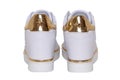 White sneaker isolated. Close-up of a pair white elegant stylish female leather high-heeled sport shoes isolated on a white