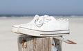 White sneaker shoes - At the beach Royalty Free Stock Photo
