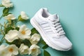 White sneakers on a blue background. Fashionable shoes for walking and sports Royalty Free Stock Photo