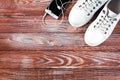 White sneakers, earphone and phone on wooden background. Sports flatlay. Fitness concept. Top view. Place for text Royalty Free Stock Photo