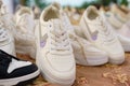 White sneakers, a knockoff of a famous brand, on the counter of a trade booth at a fair. Royalty Free Stock Photo