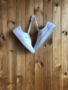 White sneakers on a wood background