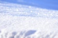 White snow closeup. Fluffy snow texture. Winter background with fresh snow