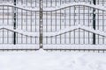 White snow covered fence. Royalty Free Stock Photo