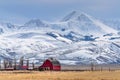 Towering Snow Covered Mountains Above a Small Farm in Montana Royalty Free Stock Photo