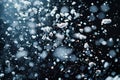 White snow falling on a black background, with a snowfall texture of particles. the artwork depicts a snow scene Royalty Free Stock Photo
