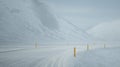 Blur yellow pole in the road full of snow.