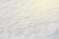 White snow shining in the sun close-up texture natural background, toned Royalty Free Stock Photo