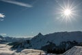 Snow and sun on the top of the mountains and fog down the valley Royalty Free Stock Photo