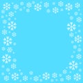 White snowflake on blue background for winter with blank space in the center