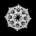 White snowflake cut out of paper on black background Royalty Free Stock Photo