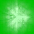 A white snowflake on a green background. Green abstraction with a drawing in the center. A bright explosion Royalty Free Stock Photo