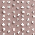 White snowflake shapes and small clouds are arranged in a seamless repeating pattern on a soft beige background in a minimal Royalty Free Stock Photo