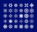 White snowflakes on a dark blue background. A set of snowflakes for every taste. Christmas stickers in the form of snowflakes.