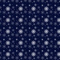 White snowflakes on a dark blue winter Christmas background. New Year theme Royalty Free Stock Photo