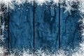 Blue Christmas background or greeting card with snowflakes frame on wood