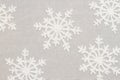 White snowflakes on gray material holiday background