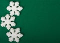 White snowflakes on green Christmas, New Year background Royalty Free Stock Photo