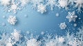 White snowflakes scattered on a light blue background, creating a festive winter frame Royalty Free Stock Photo