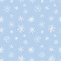 White snowflakes seamless pattern on light blue background. Minimal winter texture for Christmas wrapping and packaging. Vector Royalty Free Stock Photo