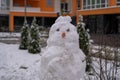 white snowman with carrot nose, made of snow, snowperson Royalty Free Stock Photo