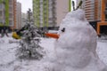 white snowman with carrot nose, made of snow, snowperson Royalty Free Stock Photo