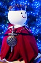 White snowman with red cloth in garden Royalty Free Stock Photo