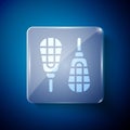 White Snowshoes icon isolated on blue background. Winter sports and outdoor activities equipment. Square glass panels