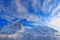 White snowy mountain, blue glacier Svalbard, Norway. Ice in ocean. Iceberg twilight, ocean. Pink clouds with ice floe. Beautiful l Royalty Free Stock Photo