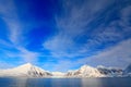 White snowy mountain, blue glacier Svalbard, Norway. Ice in ocean. Iceberg twilight, ocean. Pink clouds with ice floe. Beautiful l Royalty Free Stock Photo