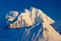 White snowy mountain peak, blue glacier Svalbard, Norway. Ice in ocean. Iceberg in North pole. Beautiful landscape. Snowy hill wit