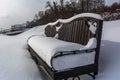 White snowy street, pathway along the park trees surrounded with a beautiful black cast iron fence, elegant wrought iron Royalty Free Stock Photo