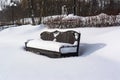 White snowy street, pathway along the park trees surrounded with a beautiful black cast iron fence, elegant wrought iron Royalty Free Stock Photo