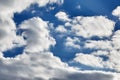 White soaring clouds on a blue sky background