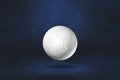 White soccer ball on a dark blue studio background Royalty Free Stock Photo