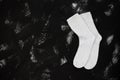 White socks on black background. Back to school image, banner, education concept