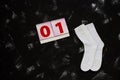 White socks and school supplies on black background. The first of september. Back to school concept Royalty Free Stock Photo